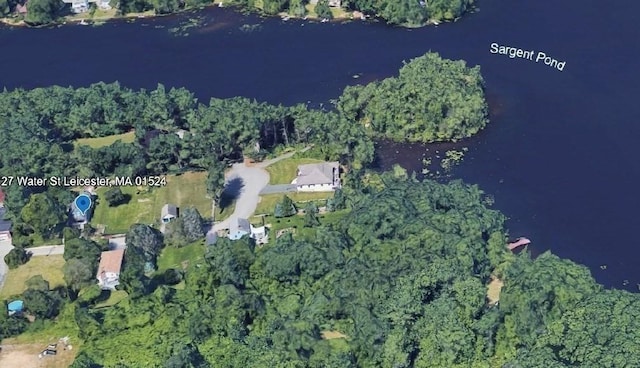 aerial view of property and surrounding area featuring a large body of water