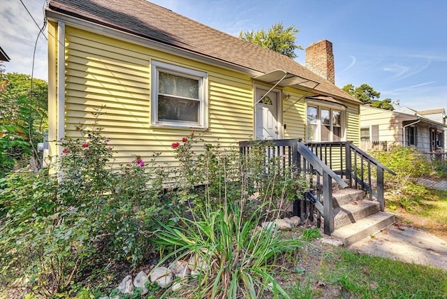 44 Georgetown St, Springfield, MA 01104 - view of front of home with a chimney
