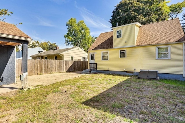 44 Georgetown St, Springfield, MA 01104 - back of house with a patio area and roof with shingles