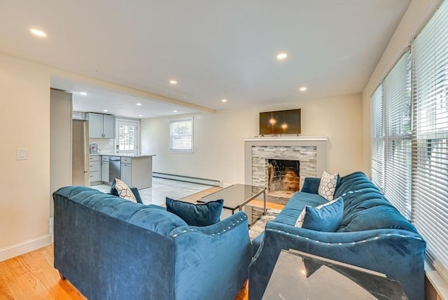 44 Georgetown St, Springfield, MA 01104 - living room featuring light wood-type flooring, a baseboard heating unit, recessed lighting, and a fireplace