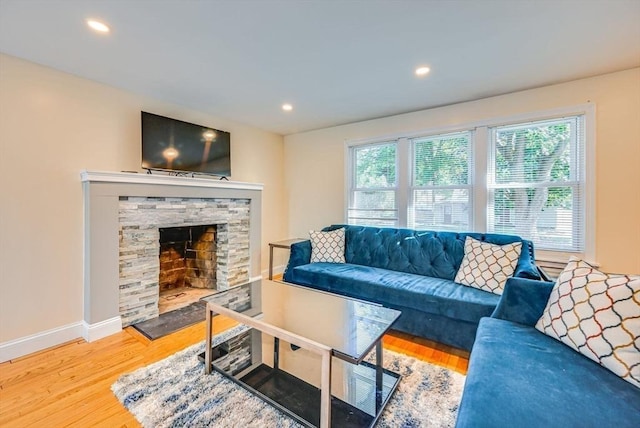 44 Georgetown St, Springfield, MA 01104 - living area with wood finished floors, recessed lighting, and a stone fireplace