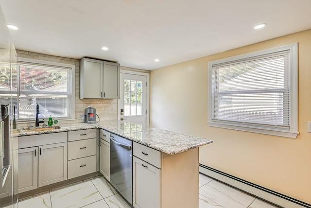 44 Georgetown St, Springfield, MA 01104 - kitchen with a baseboard radiator, dishwasher, a peninsula, light stone counters, and light marble finish floors