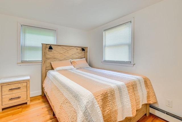 44 Georgetown St, Springfield, MA 01104 - bedroom with a baseboard heating unit and light wood-style flooring