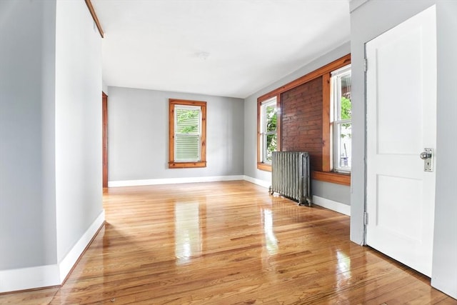 17 Manhattan St, Springfield, MA 01109 - spare room with radiator, baseboards, and light wood finished floors