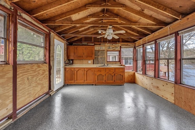 unfurnished sunroom with a sink and lofted ceiling