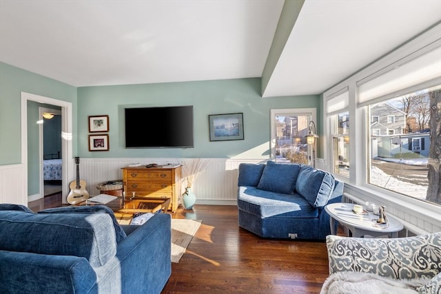 living room with a wealth of natural light and dark hardwood / wood-style floors