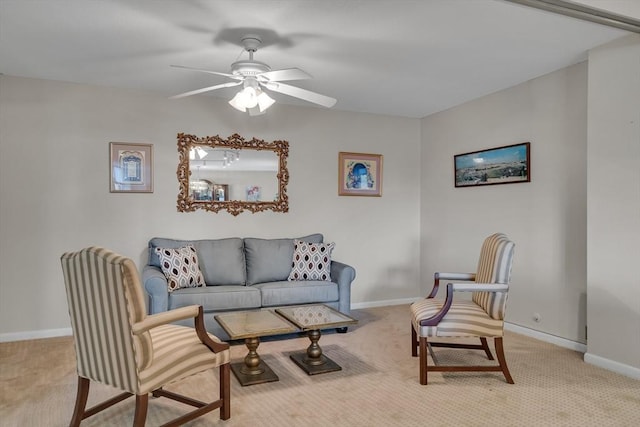 carpeted living room with ceiling fan