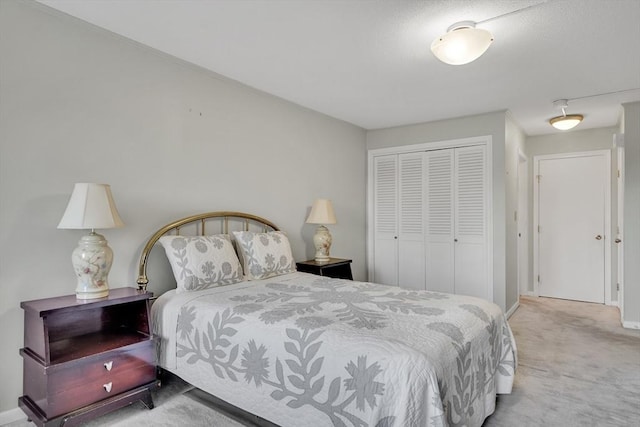 carpeted bedroom with a closet