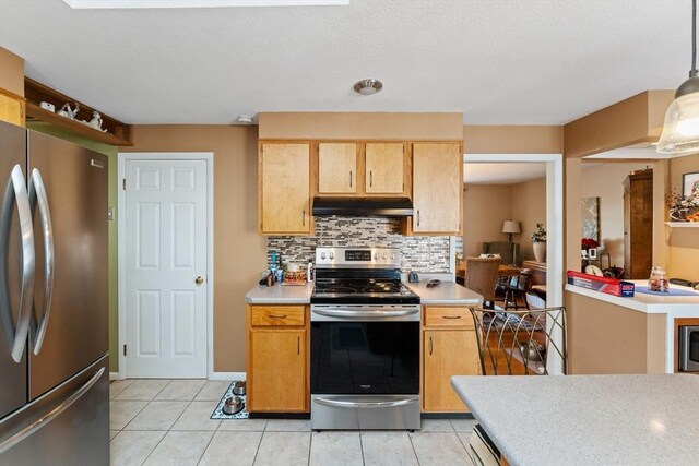 1 Redgate Ln, Holden, MA 01520 - kitchen featuring appliances with stainless steel finishes, under cabinet range hood, light countertops, tasteful backsplash, and light tile patterned flooring