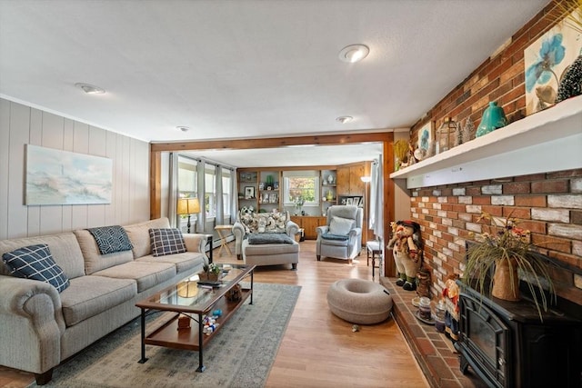 1 Redgate Ln, Holden, MA 01520 - living room with a wood stove, wood finished floors, and wood walls