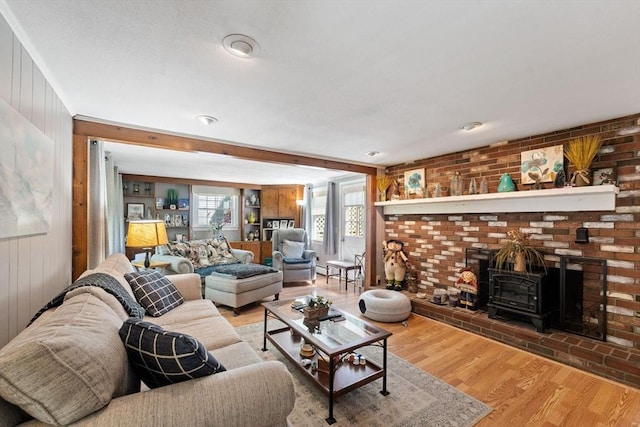 1 Redgate Ln, Holden, MA 01520 - living area with a wood stove, wood finished floors, and wooden walls