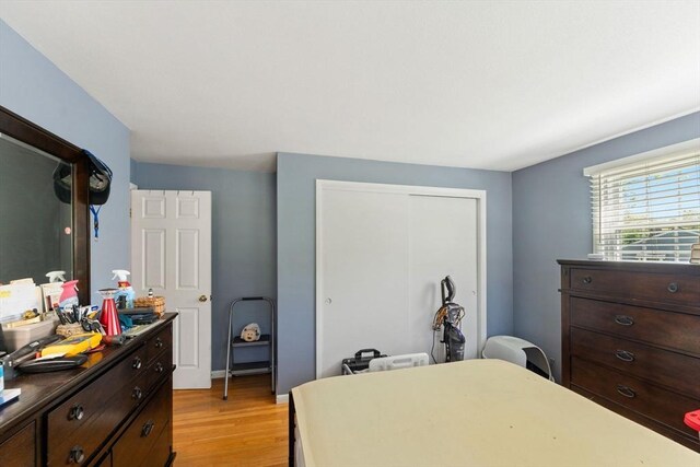 1 Redgate Ln, Holden, MA 01520 - bedroom with light wood-style floors, a closet, and a desk