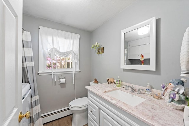 1 Redgate Ln, Holden, MA 01520 - bathroom with a baseboard radiator, vanity, and wood finished floors