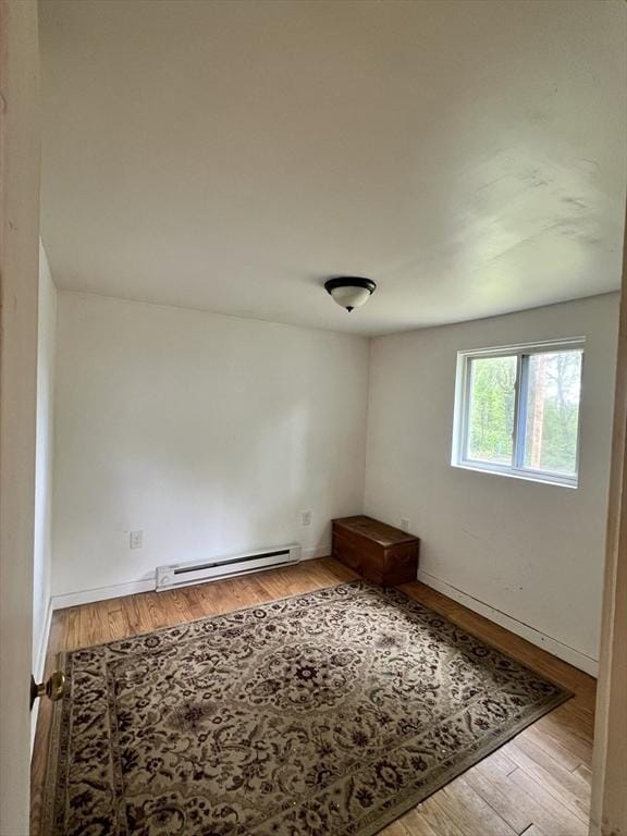 11 Summit Ave, Lakeville, MA 02347 - spare room with baseboard heating, wood finished floors, and baseboards