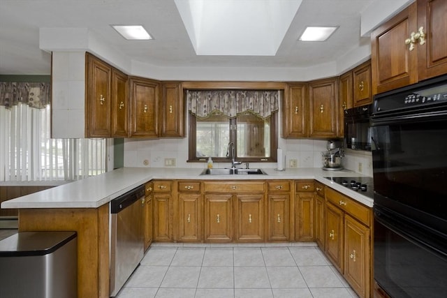 90 Westwood Ave, East Longmeadow, MA 01028 - kitchen with a peninsula, light countertops, brown cabinets, a sink, and black appliances