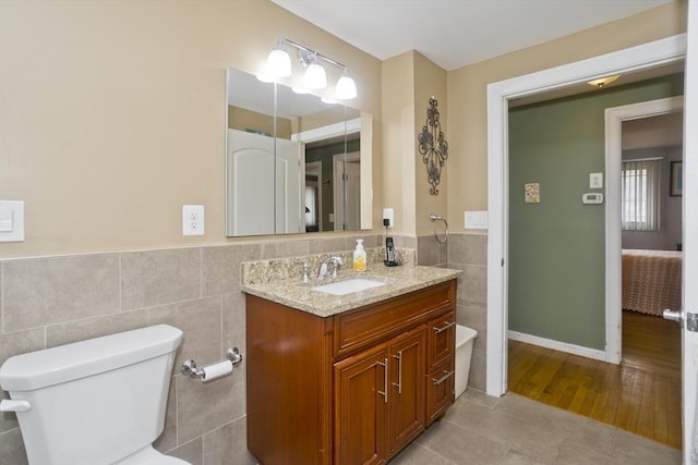90 Westwood Ave, East Longmeadow, MA 01028 - bathroom with tile patterned flooring, wainscoting, vanity, and tile walls