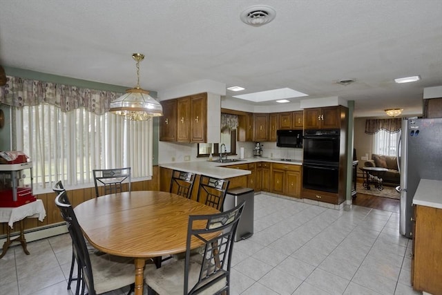 90 Westwood Ave, East Longmeadow, MA 01028 - dining space featuring light tile patterned floors, baseboard heating, and visible vents