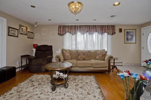 90 Westwood Ave, East Longmeadow, MA 01028 - living room with baseboards, baseboard heating, and wood finished floors