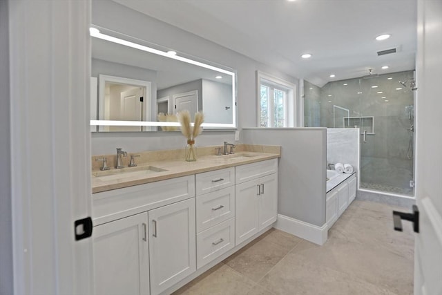 bathroom featuring tile patterned floors, vanity, and separate shower and tub