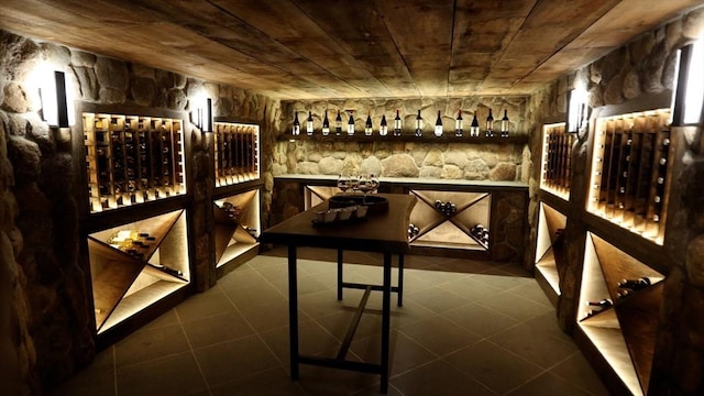 wine cellar featuring wooden ceiling