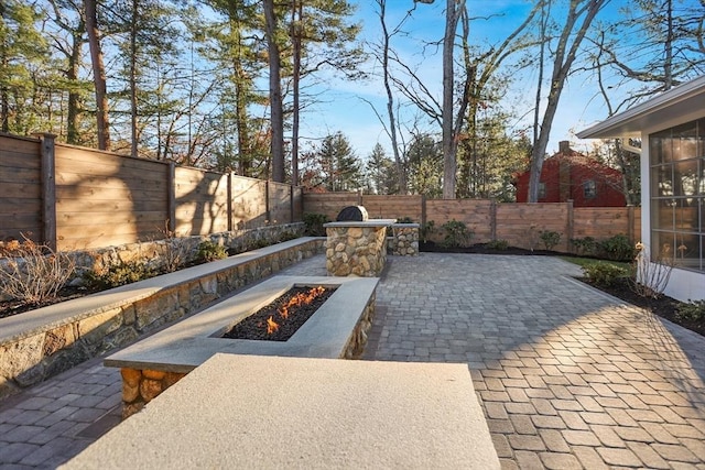 view of patio / terrace with an outdoor fire pit