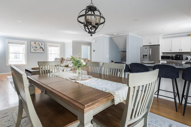 27 Mill St Unit B, Quincy, MA 02169 - dining area featuring light wood-style flooring, a chandelier, ornamental molding, and recessed lighting