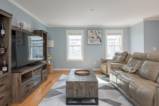27 Mill St Unit B, Quincy, MA 02169 - living room featuring plenty of natural light, ornamental molding, light wood-style floors, and baseboards