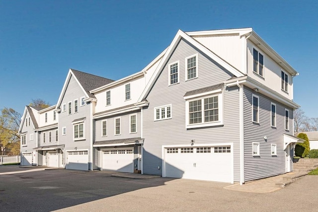27 Mill St Unit B, Quincy, MA 02169 - view of property exterior with an attached garage and driveway