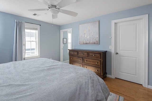 27 Mill St Unit B, Quincy, MA 02169 - bedroom featuring baseboards, wood finished floors, and a ceiling fan