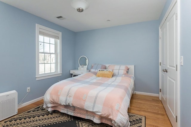 27 Mill St Unit B, Quincy, MA 02169 - bedroom with light wood-style floors, baseboards, and a closet