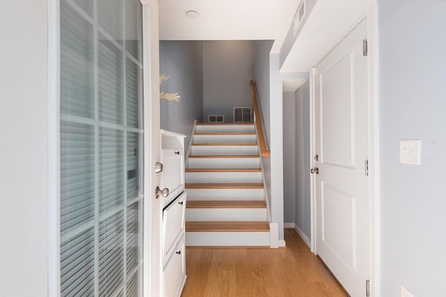 27 Mill St Unit B, Quincy, MA 02169 - staircase featuring wood finished floors and baseboards