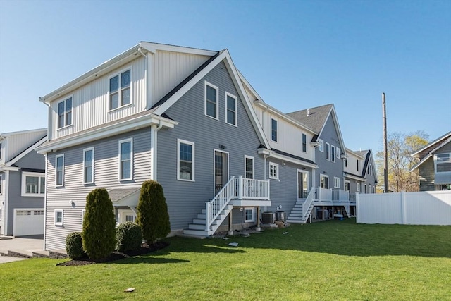 27 Mill St Unit B, Quincy, MA 02169 - rear view of property featuring stairs, cooling unit, and a garage