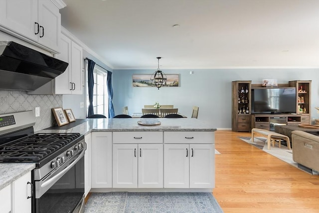 27 Mill St Unit B, Quincy, MA 02169 - kitchen featuring stainless steel range with gas cooktop, under cabinet range hood, a peninsula, light wood-style floors, and white cabinets