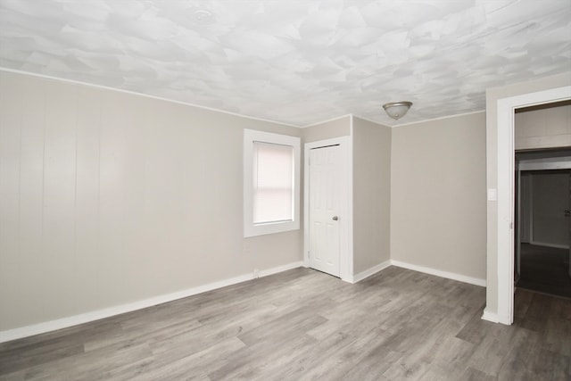 empty room with light hardwood / wood-style floors