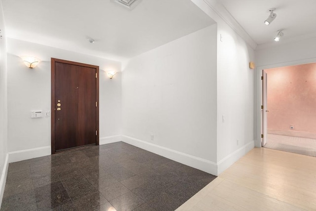 interior space with granite finish floor and baseboards