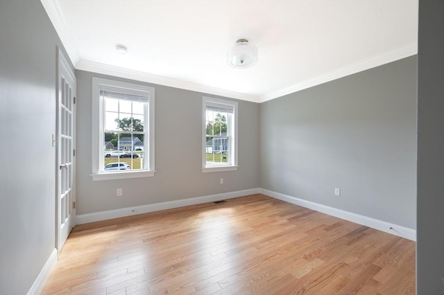 18 Tispaquin St, Middleboro, MA 02346 - spare room with crown molding, light wood finished floors, baseboards, and a smoke detector