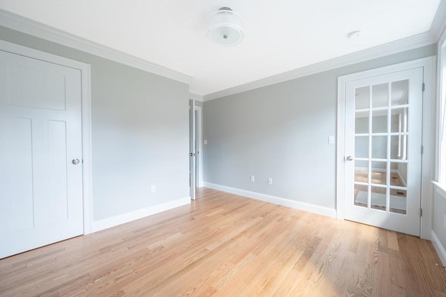 18 Tispaquin St, Middleboro, MA 02346 - spare room featuring ornamental molding, light wood-type flooring, and baseboards