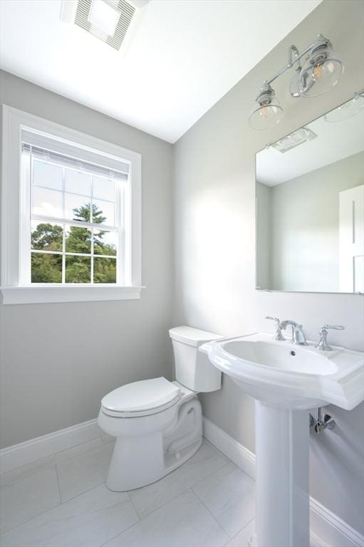 18 Tispaquin St, Middleboro, MA 02346 - half bathroom with baseboards and toilet