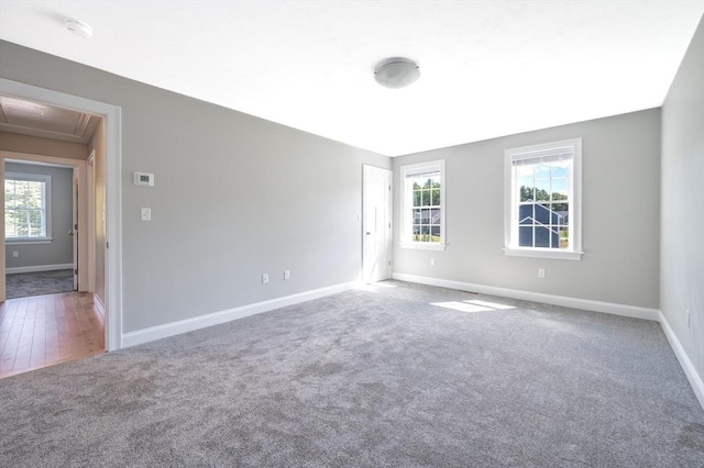 18 Tispaquin St, Middleboro, MA 02346 - empty room featuring attic access, carpet, and baseboards
