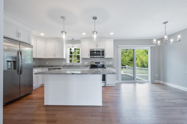 18 Tispaquin St, Middleboro, MA 02346 - kitchen featuring appliances with stainless steel finishes, healthy amount of natural light, baseboards, wood finished floors, and recessed lighting