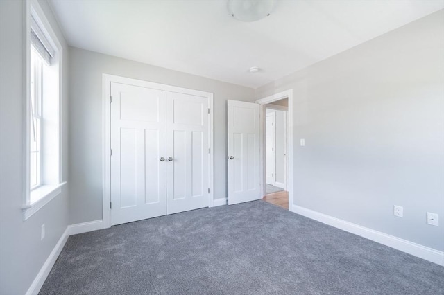 18 Tispaquin St, Middleboro, MA 02346 - unfurnished bedroom with carpet flooring, a closet, and baseboards