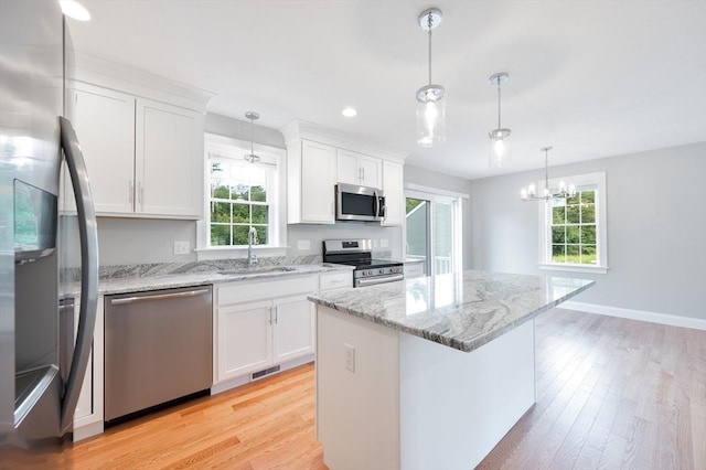 18 Tispaquin St, Middleboro, MA 02346 - kitchen featuring appliances with stainless steel finishes, a sink, white cabinetry, light wood-type flooring, and recessed lighting