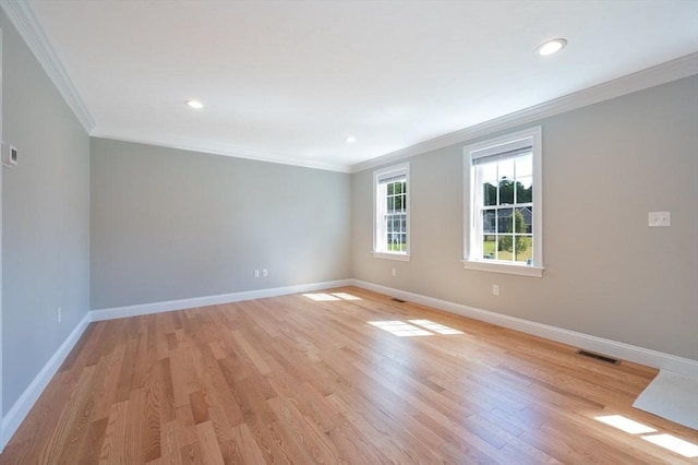 18 Tispaquin St, Middleboro, MA 02346 - spare room with crown molding, baseboards, light wood-type flooring, and recessed lighting