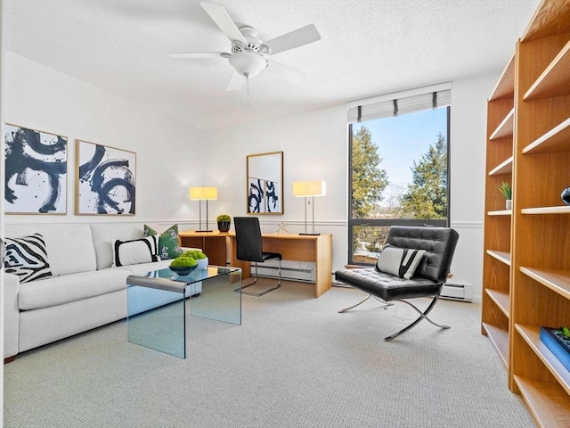 living room with a baseboard radiator, carpet flooring, ceiling fan, and a textured ceiling