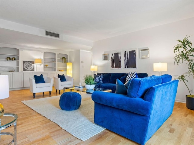 living room with light hardwood / wood-style floors