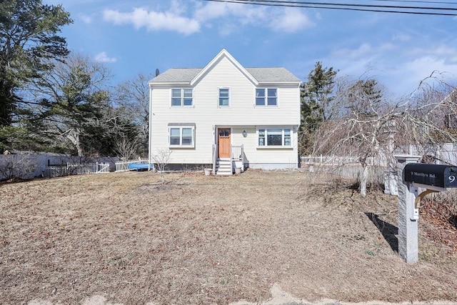 view of front of property featuring fence