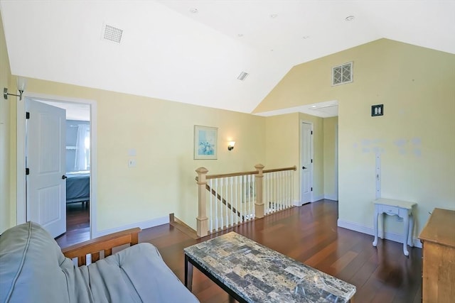 living room with dark wood finished floors, vaulted ceiling, and baseboards