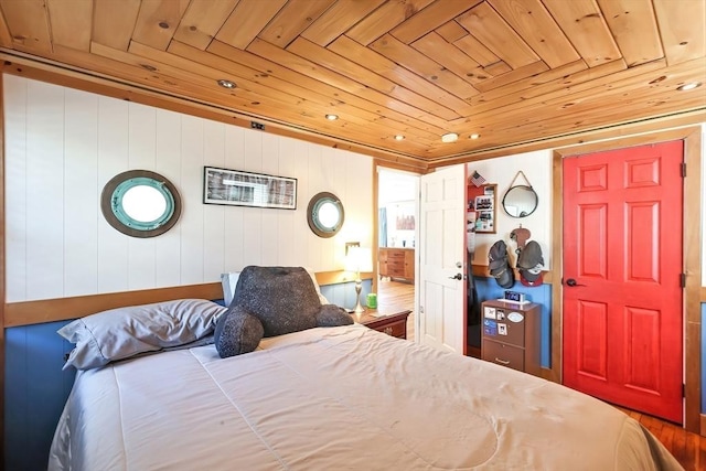 bedroom featuring wooden ceiling and wood finished floors