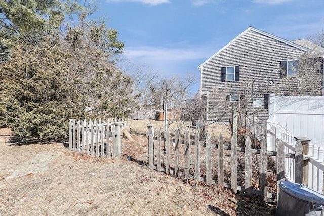 view of home's exterior featuring fence