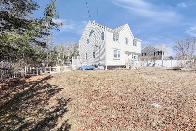 view of property exterior with a fenced backyard